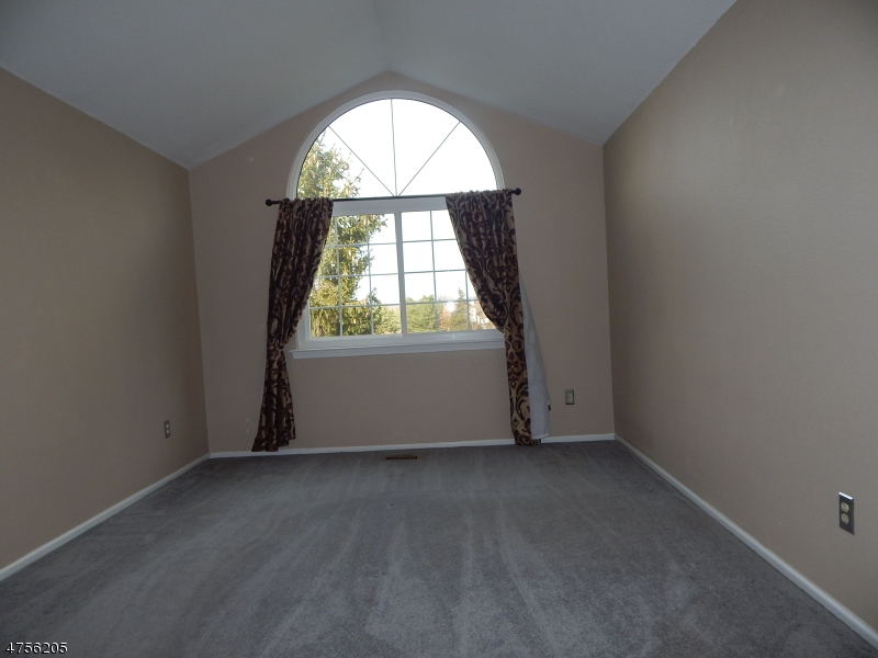 54 Wescott Road Bedminster, NJ 07921 - Photo 7 of 9 an empty room with a window