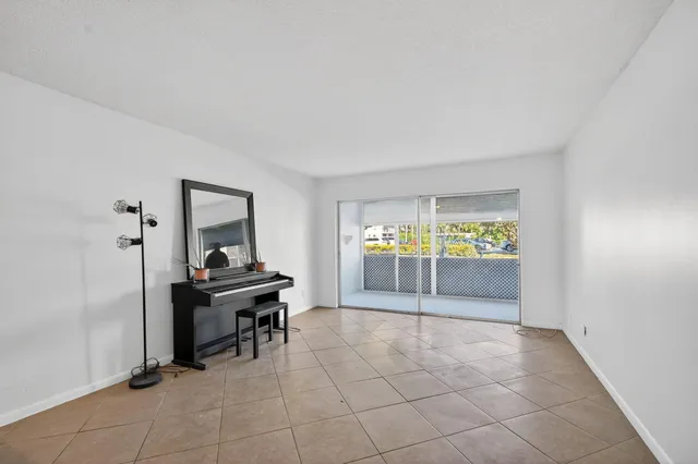 a view of a livingroom with wooden floor and furniture