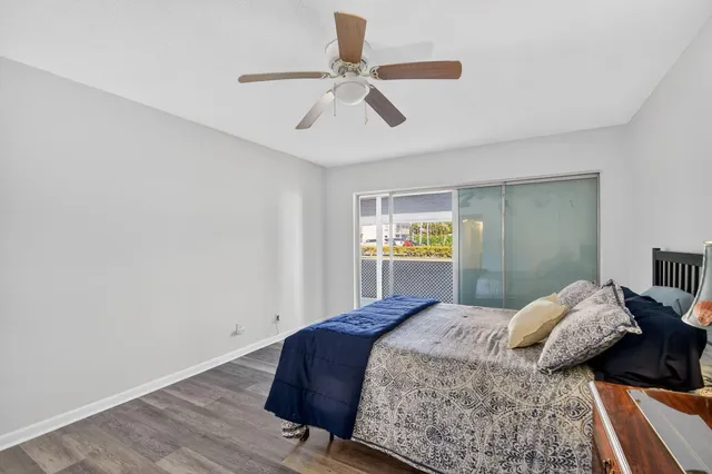 a front view of multiple houses with yard