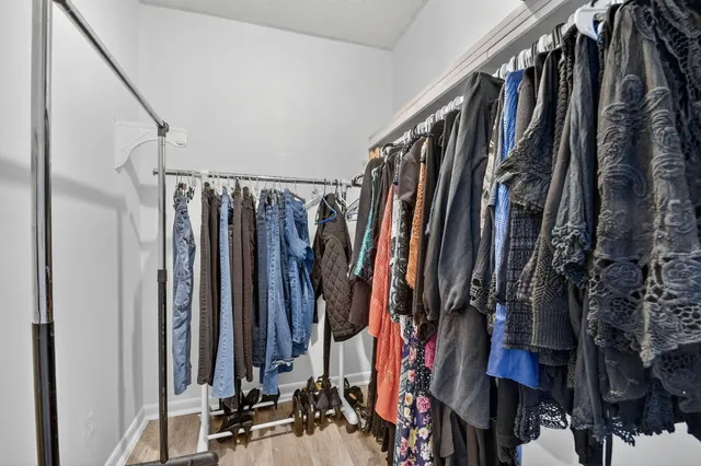 a view of a building with garden space and sitting area