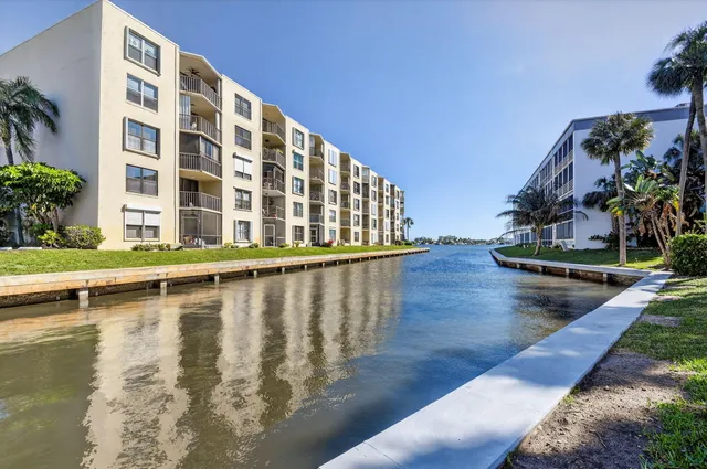 a front view of house with yard and outdoor seating