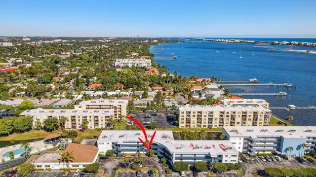 a room with pool table and windows