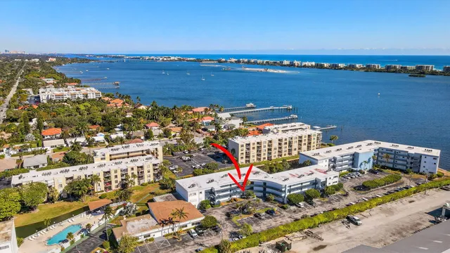 a room with gym equipment and large windows