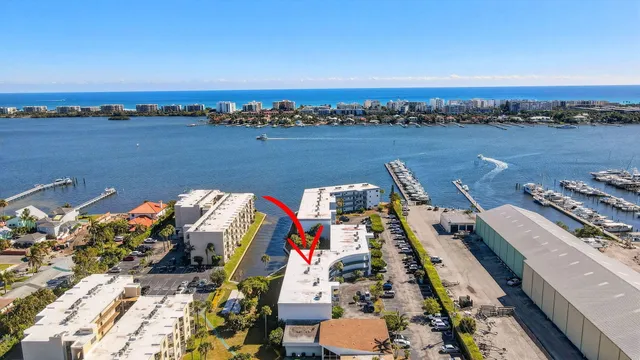 a living room with furniture a rug and a book shelf