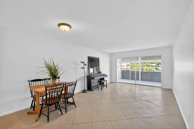 a bathroom with a sink vanity mirror and toilet