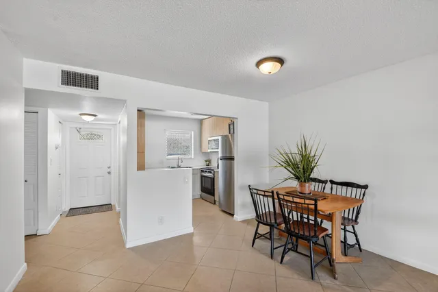 a bathroom with a toilet and a shower curtain
