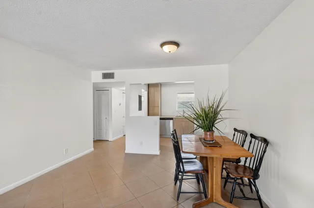 a bathroom with a sink a toilet a shower and a mirror