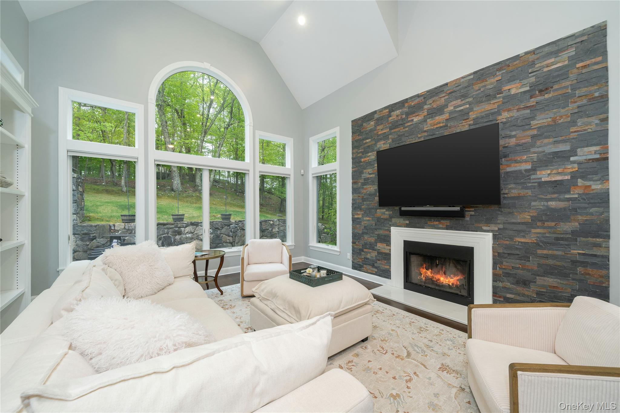 630 Chappaqua Road Briarcliff Manor, NY 10510 - Photo 14 of 41 Dramatic family room with soaring ceilings, oversized windows, and striking stone fireplace feature wall