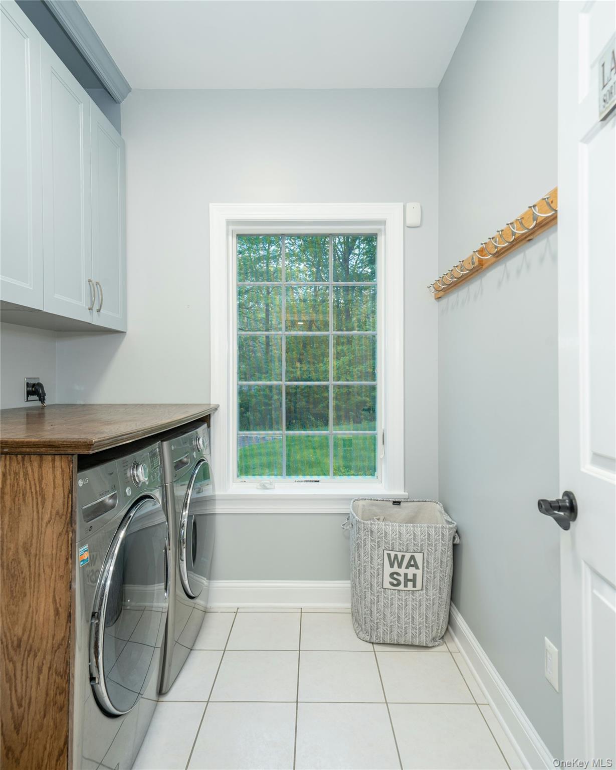 630 Chappaqua Road Briarcliff Manor, NY 10510 - Photo 22 of 41 Spacious laundry room with countertop workspace and abundant natural light