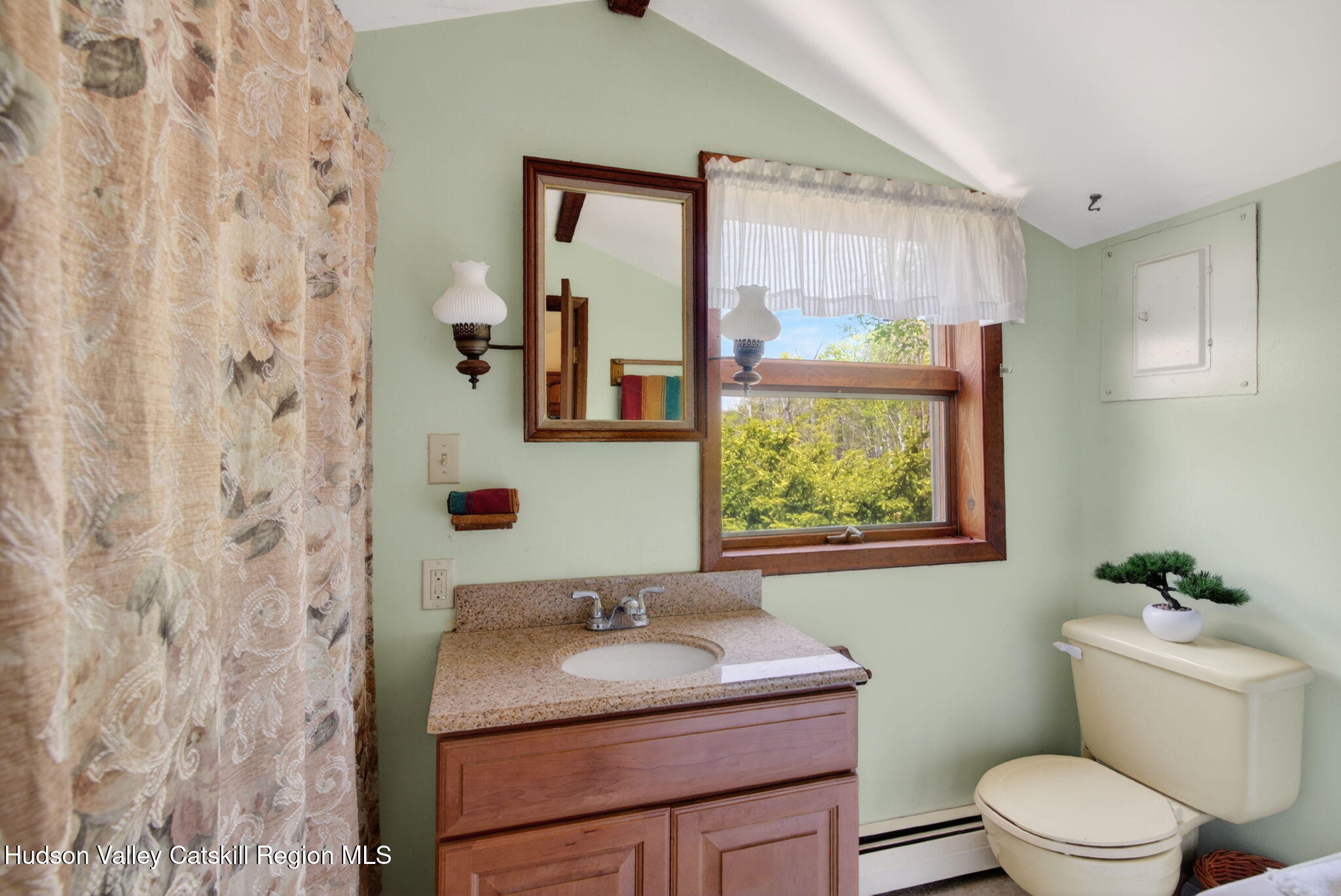 689 Old Road Windham, NY 12496 - Photo 18 of 42 a bathroom with a granite countertop sink toilet and mirror