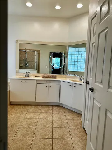 a kitchen with a sink a stove and cabinets