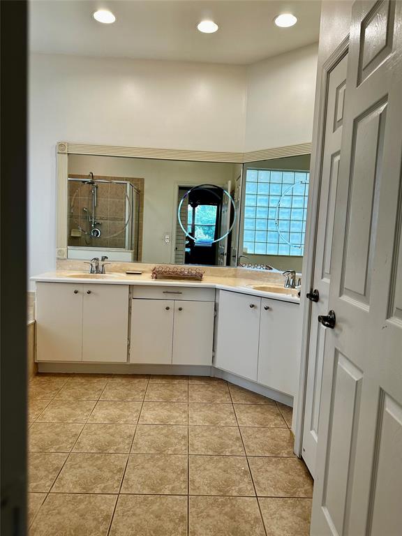 8564 Vía Giardino Boca Raton, FL 33433 - Photo 13 of 20 a kitchen with a sink a stove and cabinets