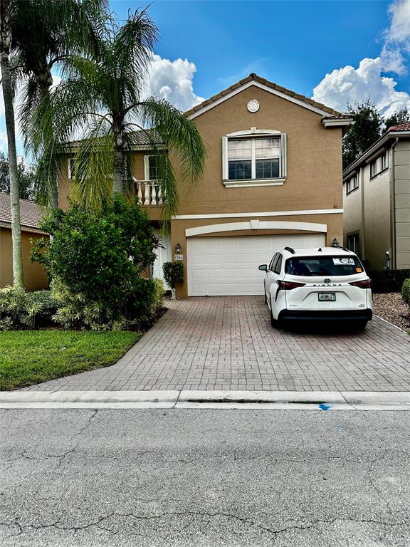8564 Vía Giardino Boca Raton, FL 33433 - Photo 20 of 20 a car parked in front of a house