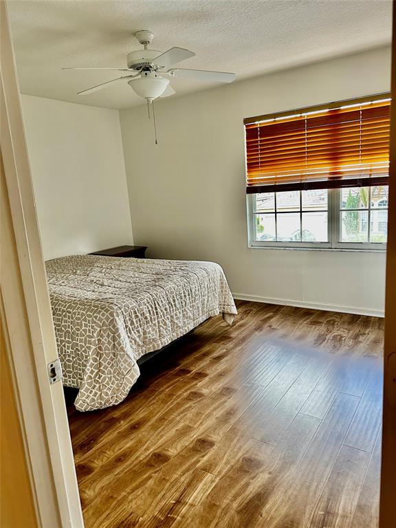 8564 Vía Giardino Boca Raton, FL 33433 - Photo 9 of 20 a bedroom with a bed and a window