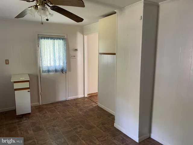 a kitchen with a stove a sink and cabinets