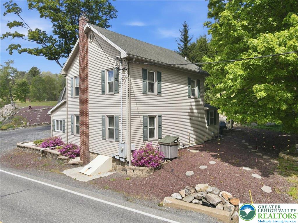 4880 Little Gap Road Kunkletown, PA 18058 - Photo 64 of 100 This classic siding home offers traditional charm with a prominent brick chimney.