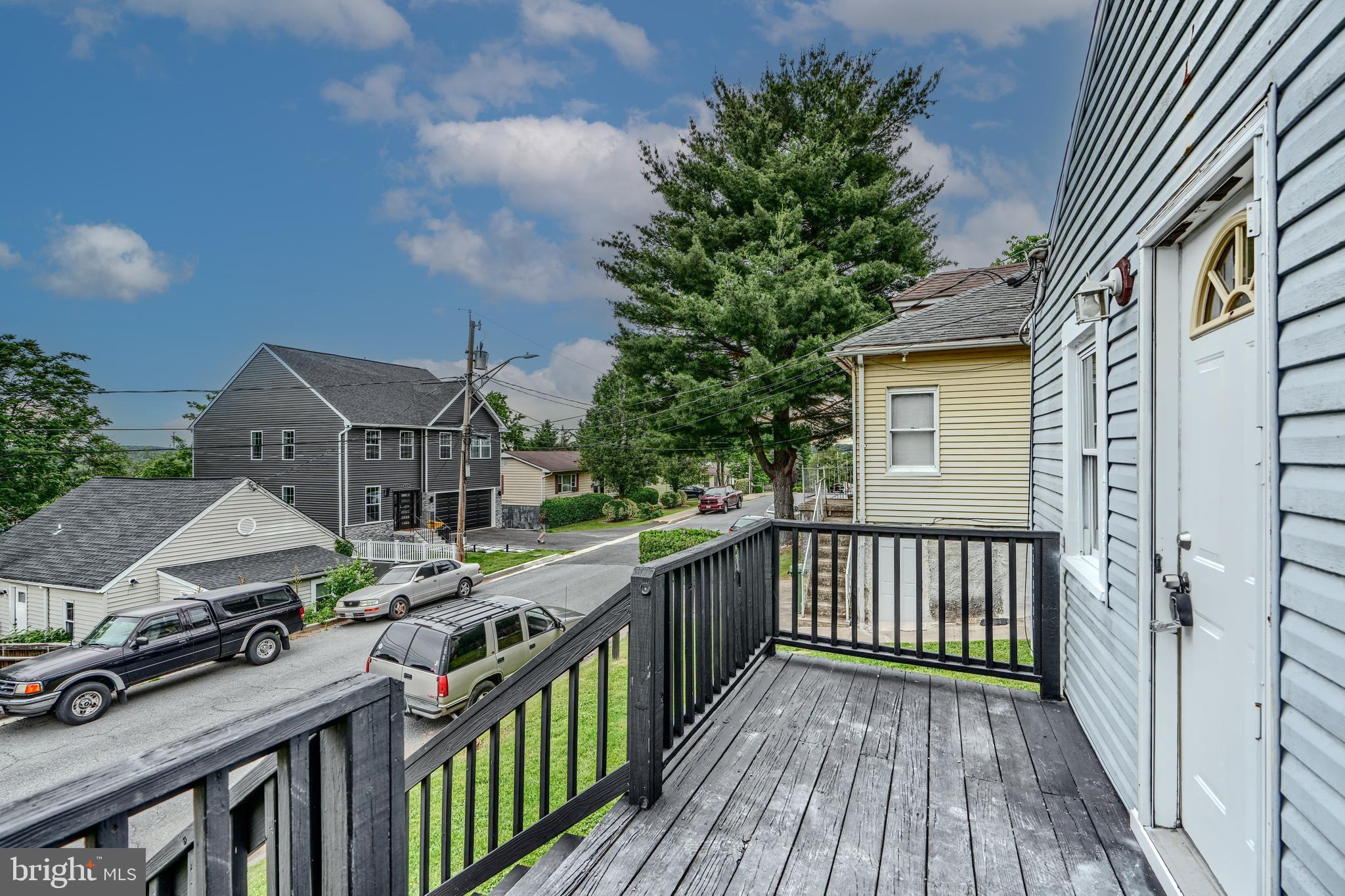 227 Elizabeth Avenue Baltimore, MD 21225 - Photo 18 of 31 a view of a house with wooden deck