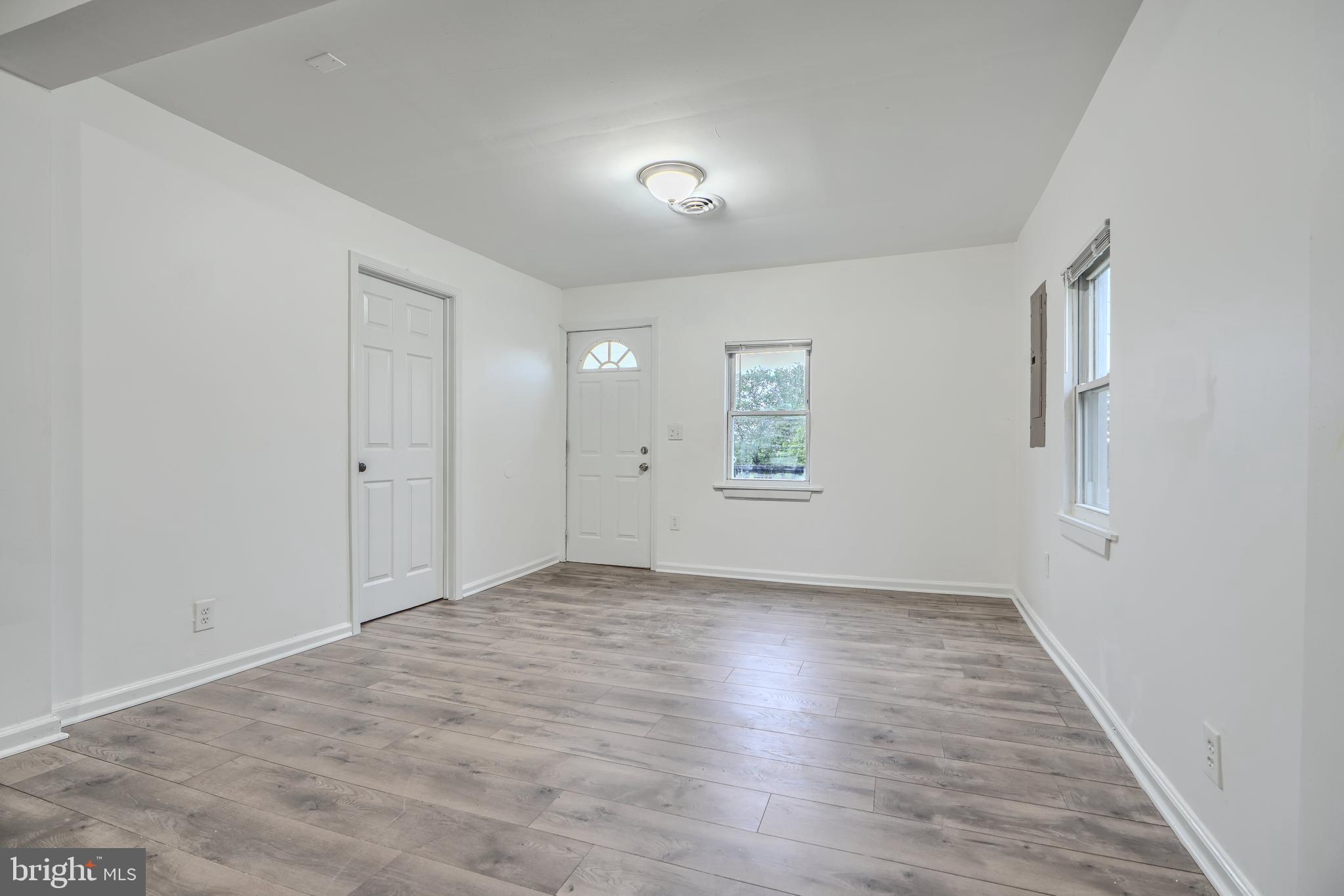 227 Elizabeth Avenue Baltimore, MD 21225 - Photo 24 of 31 wooden floor in an empty room