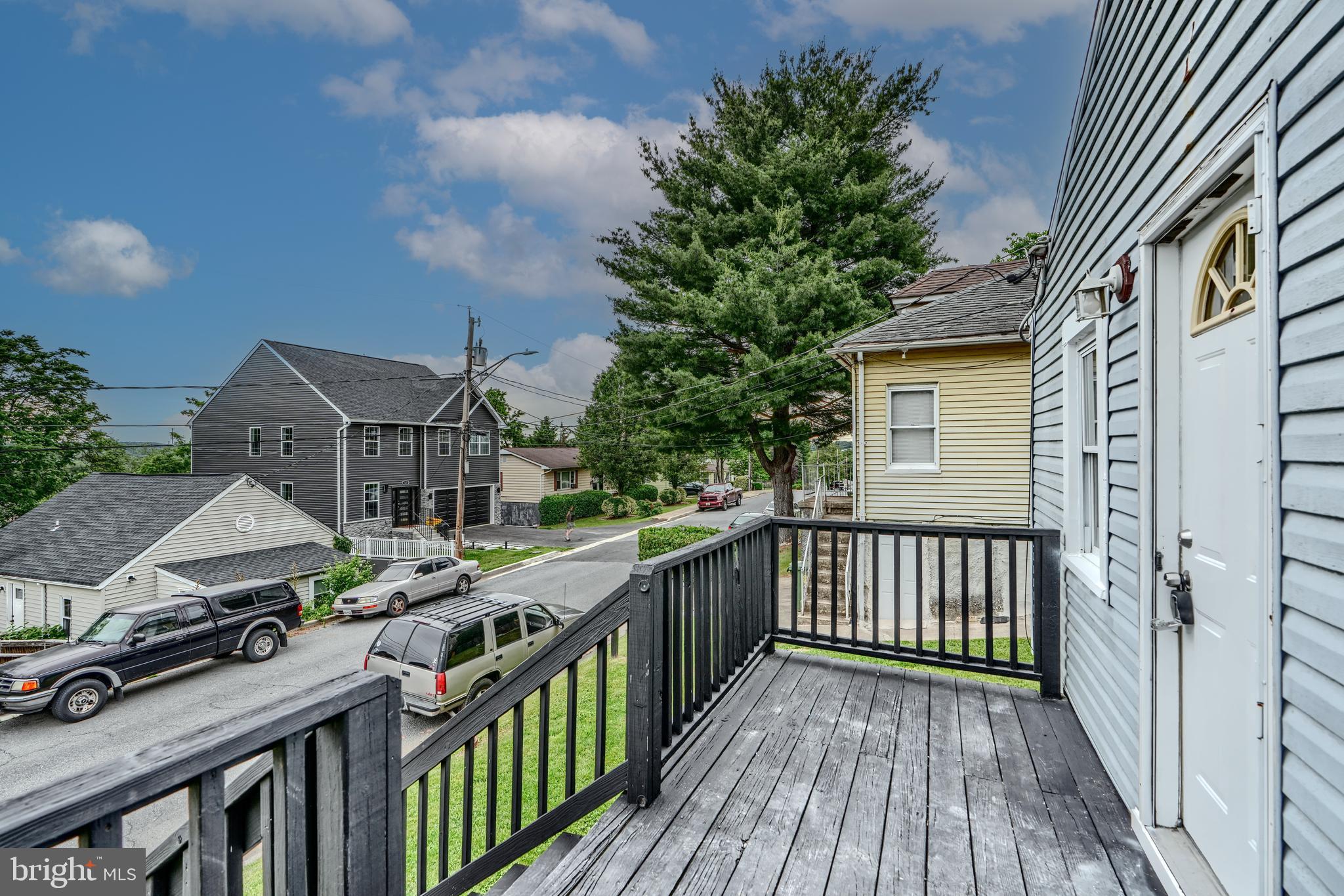 227 Elizabeth Avenue Baltimore, MD 21225 - Photo 25 of 31 a view of houses with wooden deck