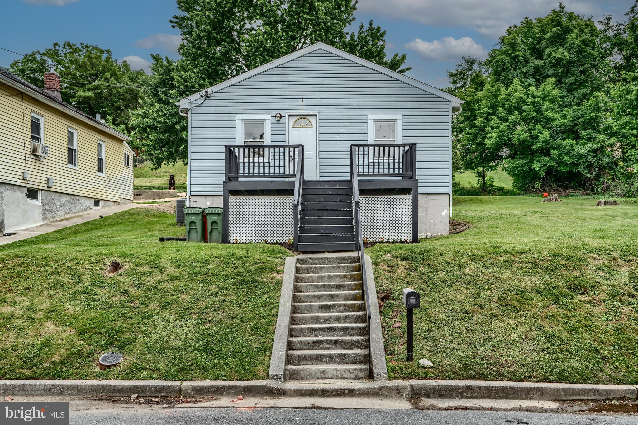 227 Elizabeth Avenue Baltimore, MD 21225 - Photo 30 of 31 front view of a house with a yard