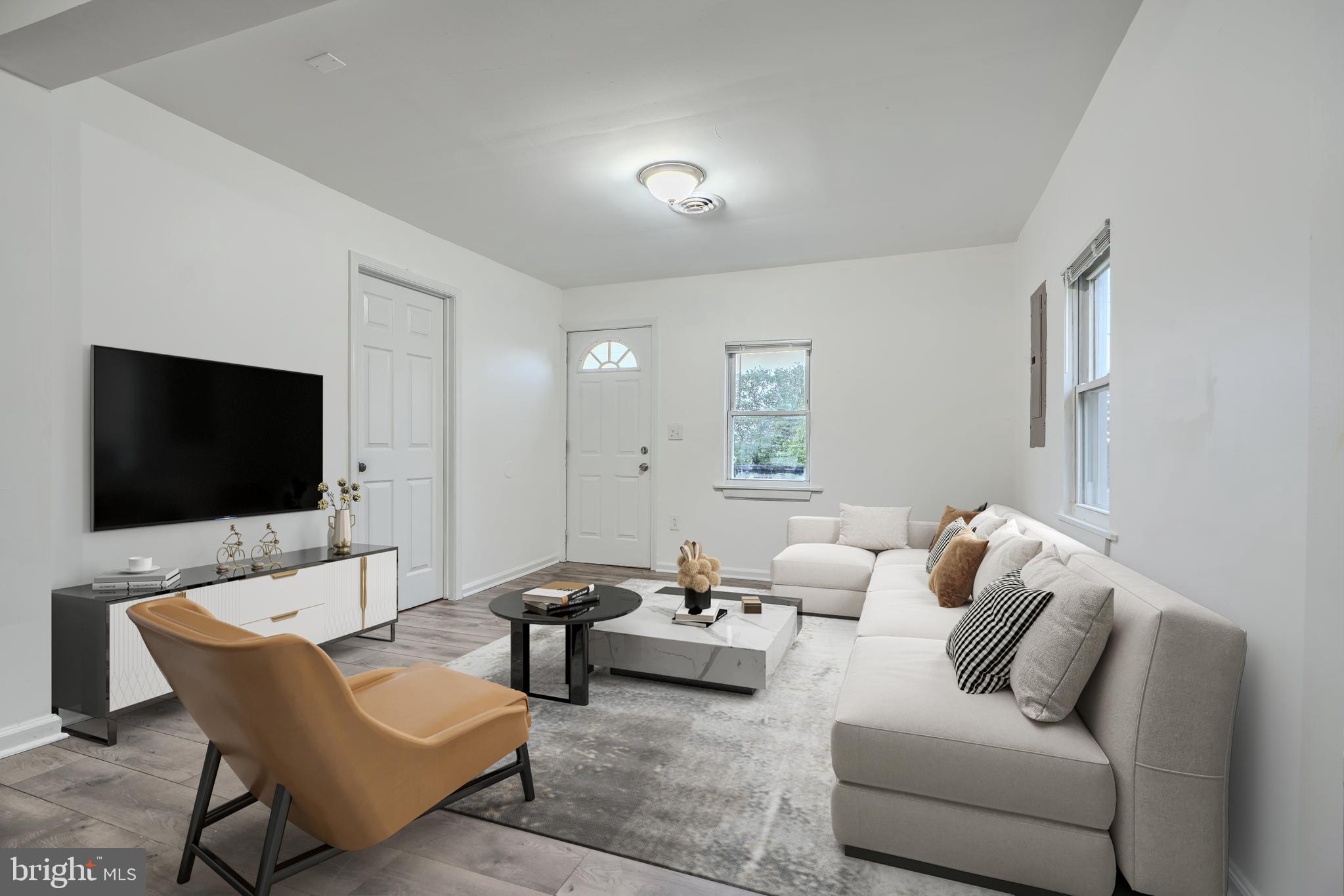 227 Elizabeth Avenue Baltimore, MD 21225 - Photo 3 of 31 a living room with furniture and a flat screen tv