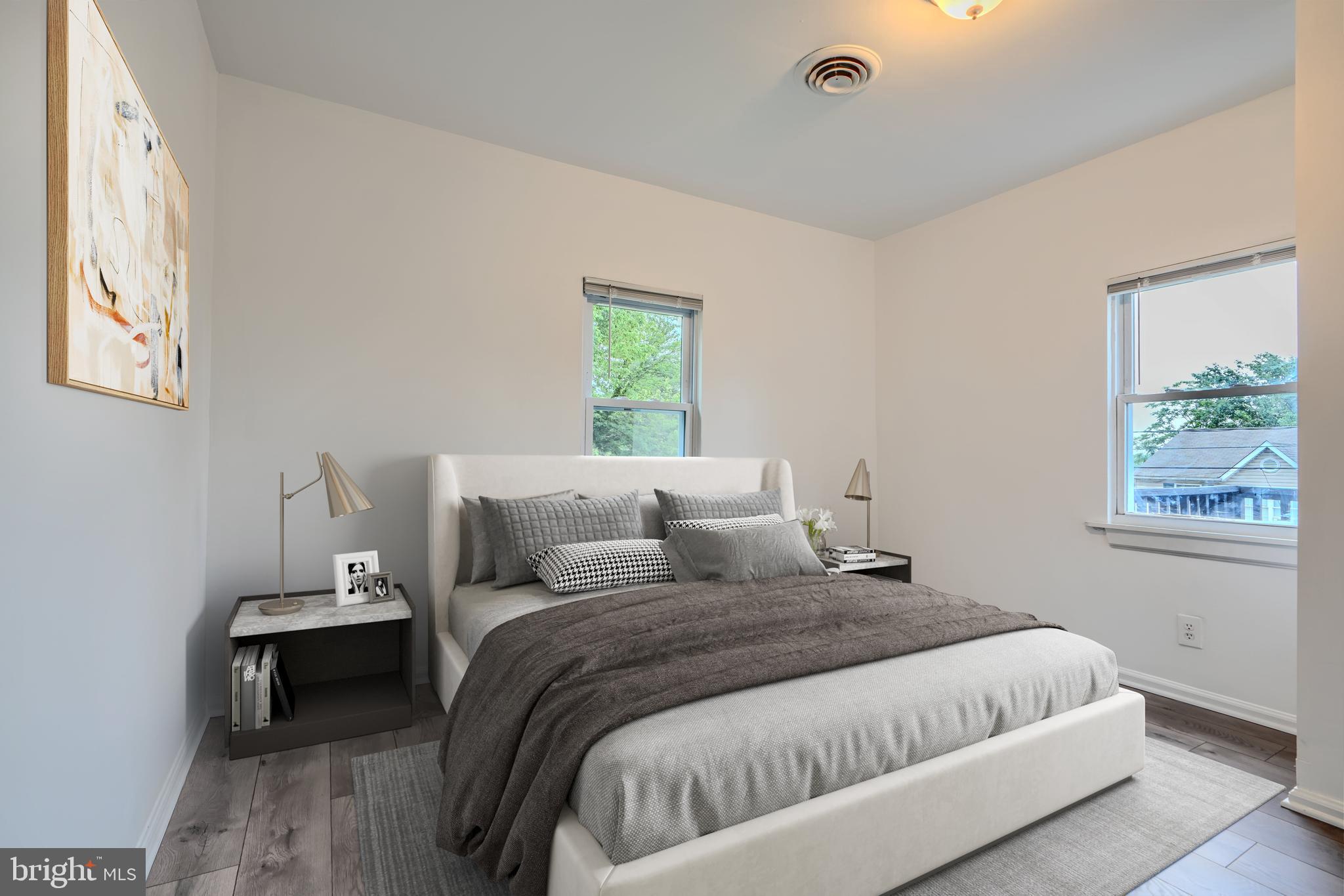 227 Elizabeth Avenue Baltimore, MD 21225 - Photo 5 of 31 a bedroom with a bed and a window