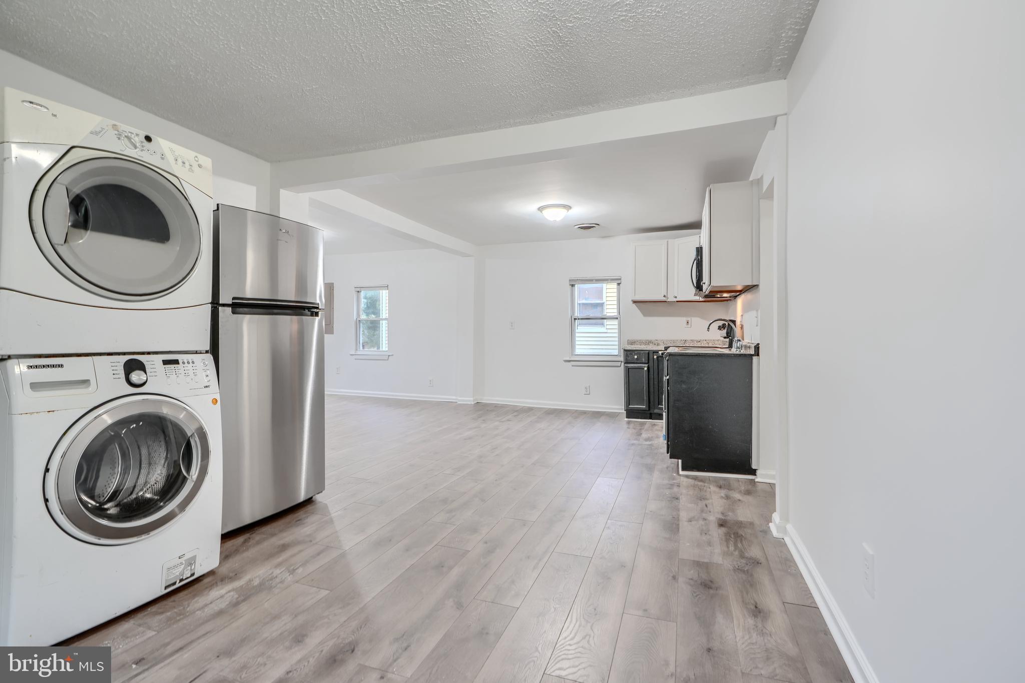 227 Elizabeth Avenue Baltimore, MD 21225 - Photo 9 of 31 a view of a kitchen with washer and dryer