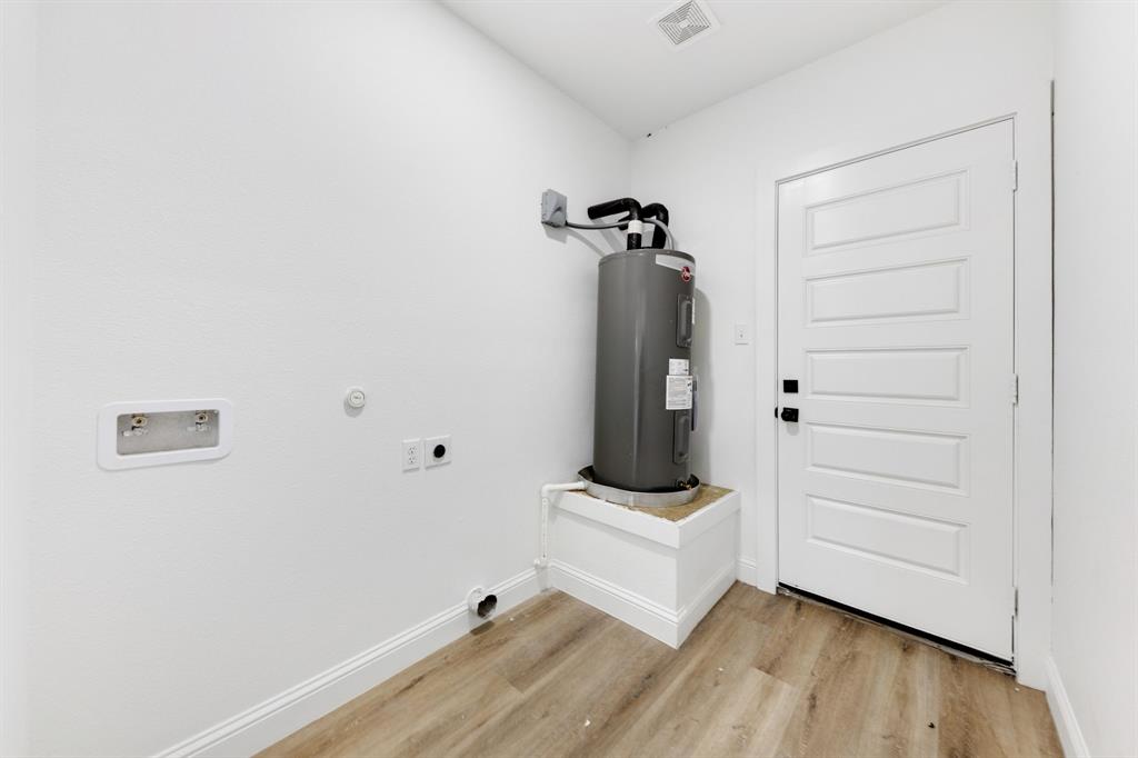 1269 Bonham Street Paris, TX 75460 - Photo 13 of 19 a view of room with wooden floor