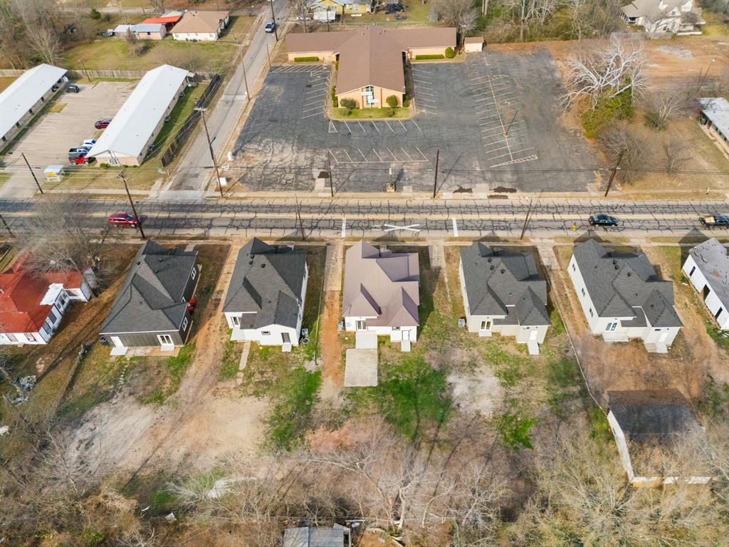 1269 Bonham Street Paris, TX 75460 - Photo 17 of 19 an aerial view of residential houses with outdoor space