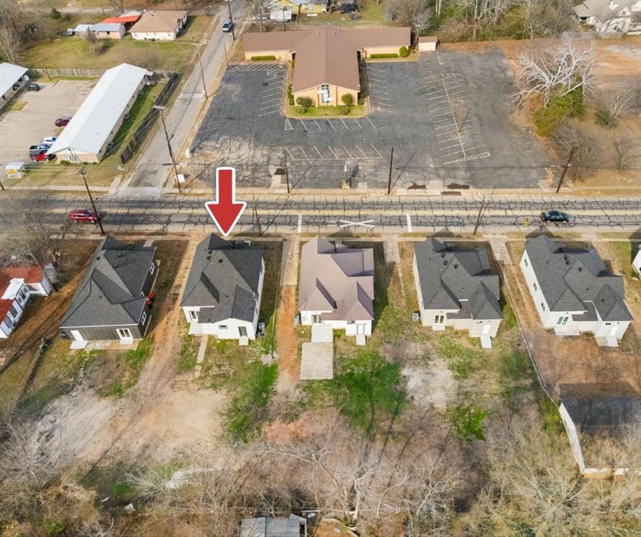 1269 Bonham Street Paris, TX 75460 - Photo 19 of 19 an aerial view of residential houses with outdoor space