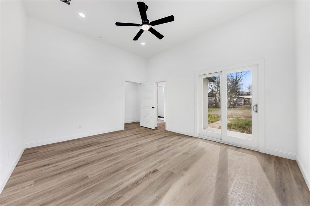 1269 Bonham Street Paris, TX 75460 - Photo 6 of 19 a view of an empty room with a window