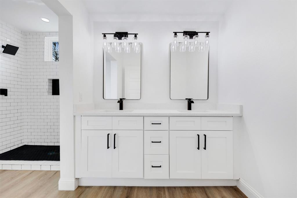 1269 Bonham Street Paris, TX 75460 - Photo 7 of 19 a bathroom with a sink and a mirror