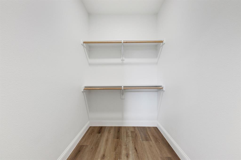 1269 Bonham Street Paris, TX 75460 - Photo 9 of 19 a small space with a white wall and a window