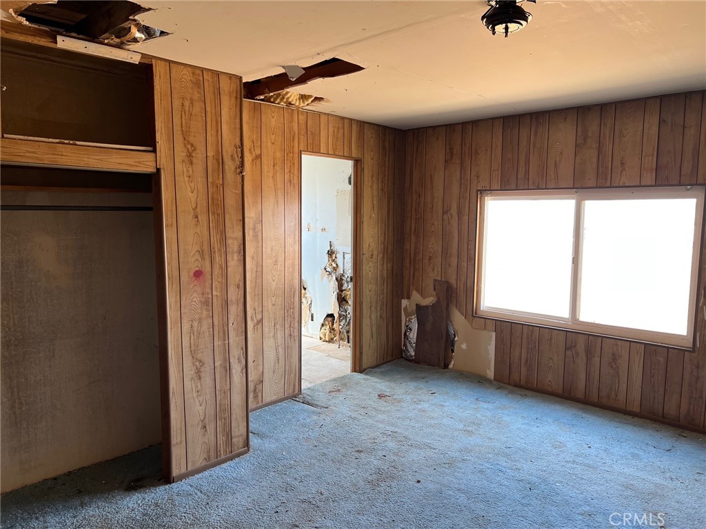 27154 Anderson Street Boron, CA 93516 - Photo 5 of 12 a view of an empty room with a window