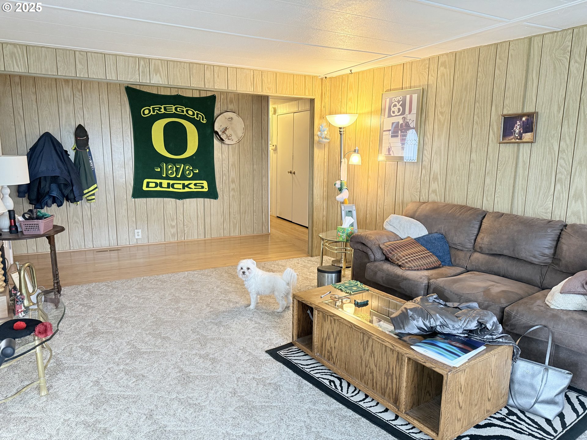 1475 Green Acres Road, Unit 40 Eugene, OR 97408 - Photo 11 of 30 a living room with furniture and a wooden floor