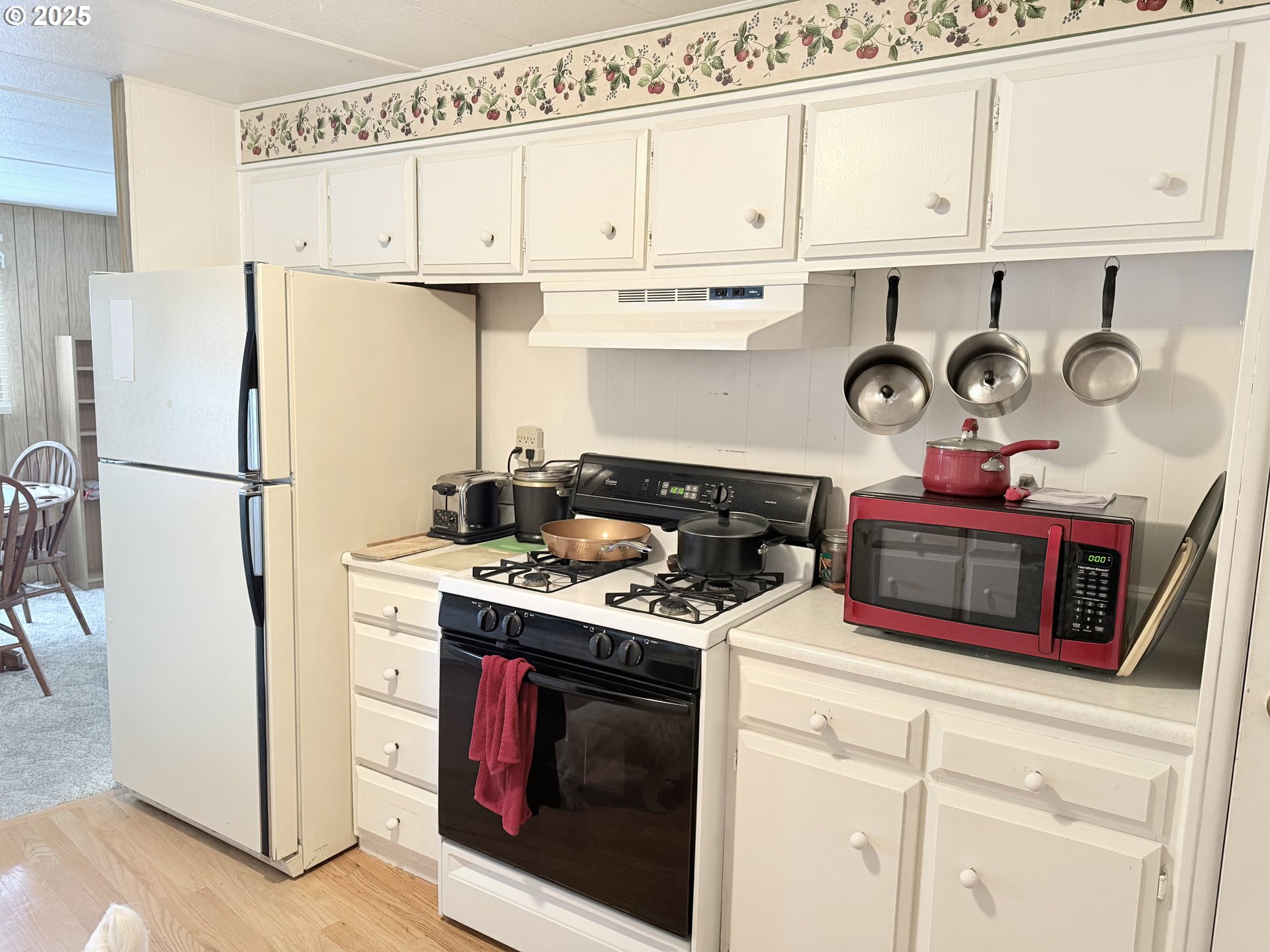1475 Green Acres Road, Unit 40 Eugene, OR 97408 - Photo 16 of 30 a kitchen with stainless steel appliances granite countertop a stove a refrigerator and a refrigerator