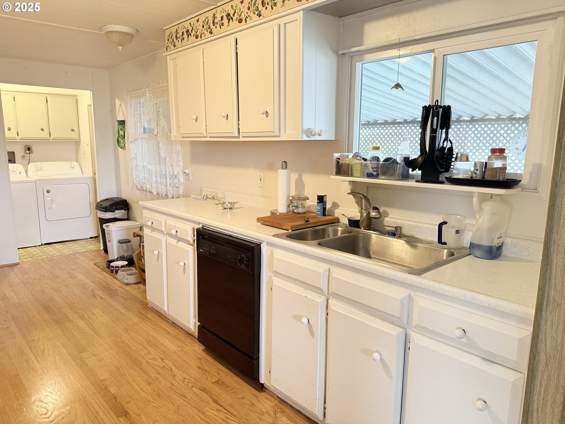1475 Green Acres Road, Unit 40 Eugene, OR 97408 - Photo 17 of 30 a kitchen with stainless steel appliances granite countertop a sink stove and cabinets