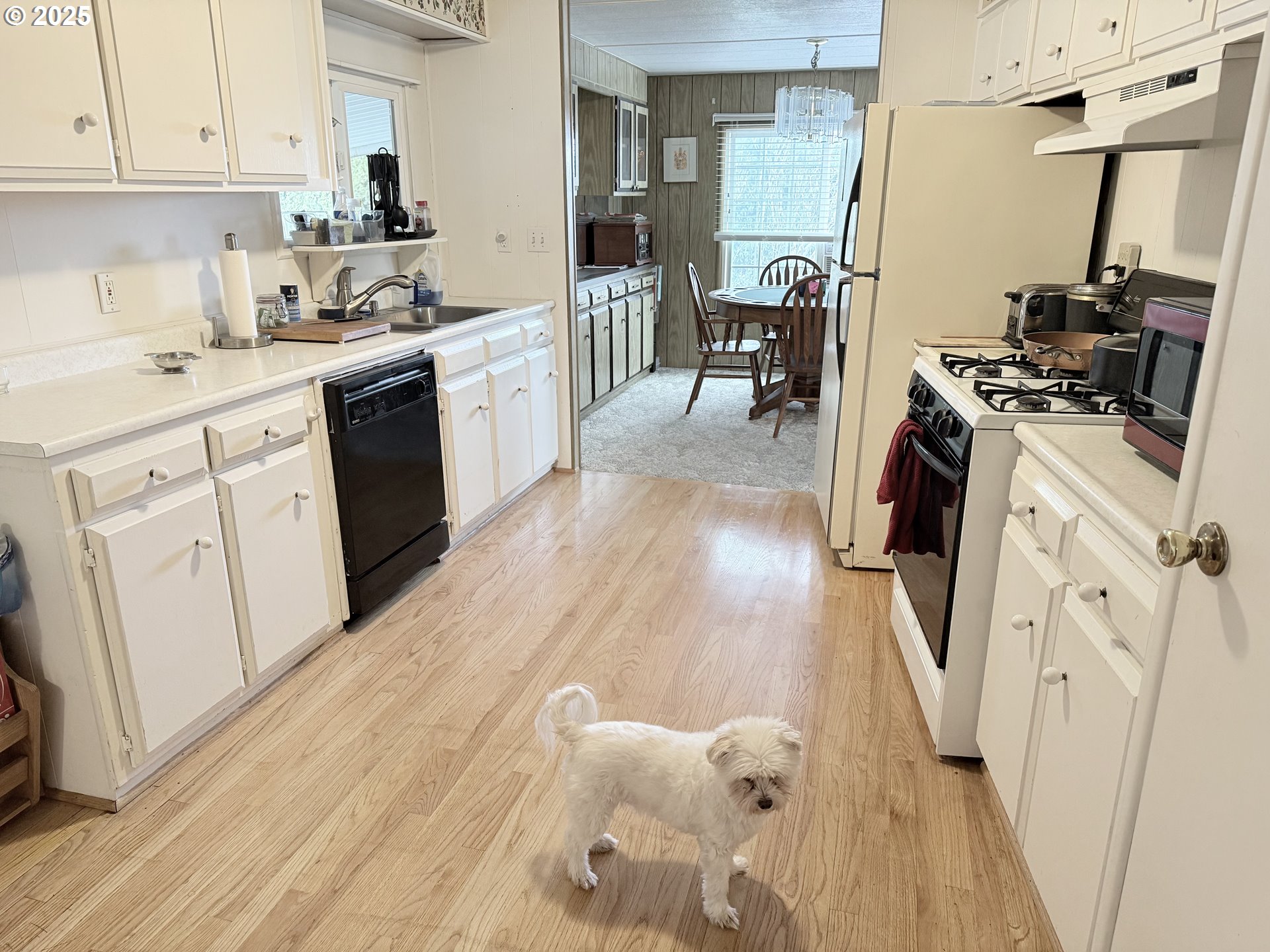 1475 Green Acres Road, Unit 40 Eugene, OR 97408 - Photo 18 of 30 a kitchen with granite countertop a sink stove and cabinets