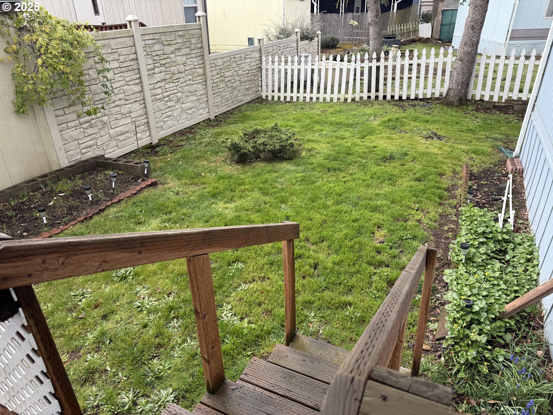 1475 Green Acres Road, Unit 40 Eugene, OR 97408 - Photo 25 of 30 a view of a deck with a yard