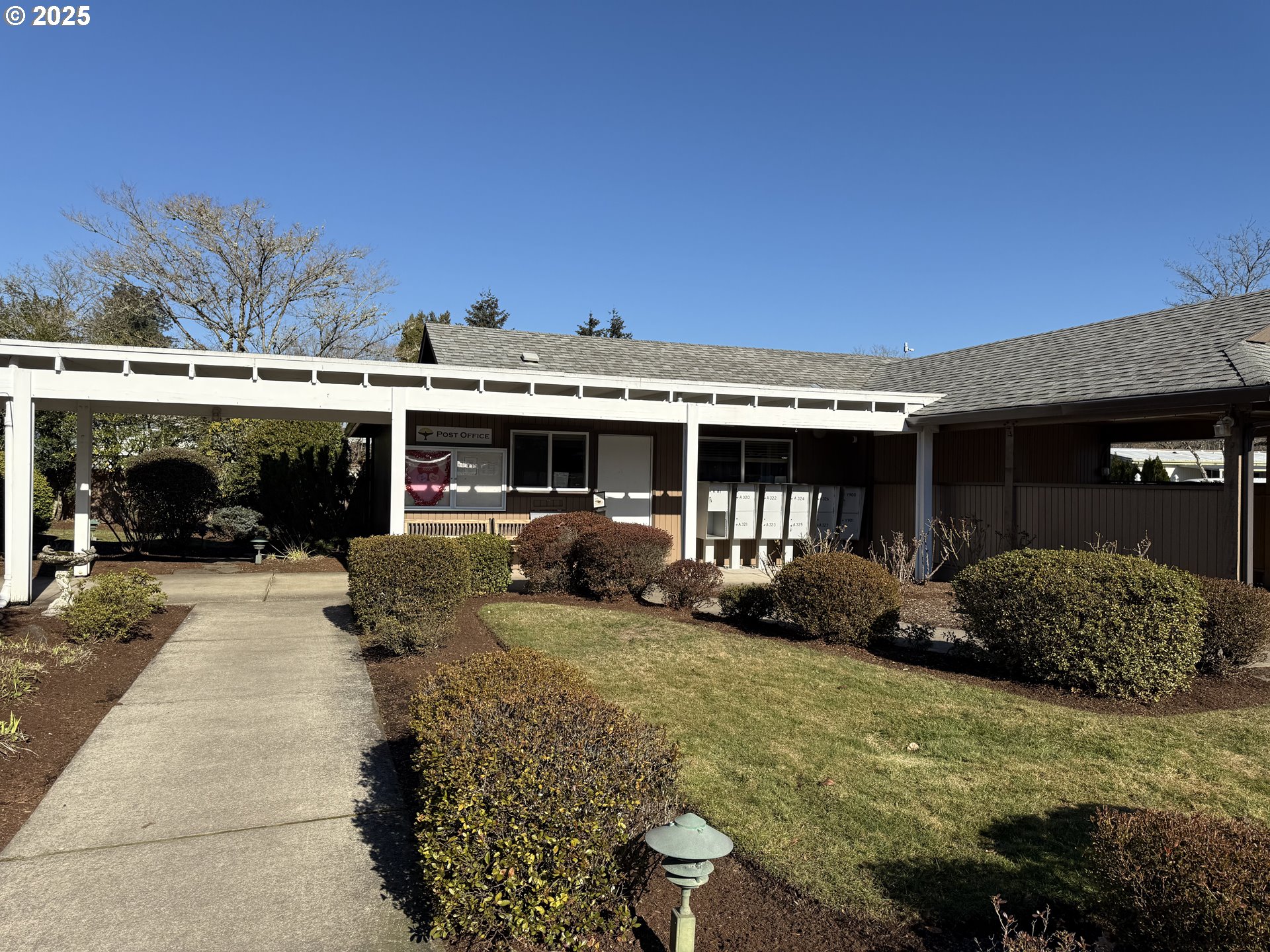 1475 Green Acres Road, Unit 40 Eugene, OR 97408 - Photo 28 of 30 a front view of a house with garden and porch