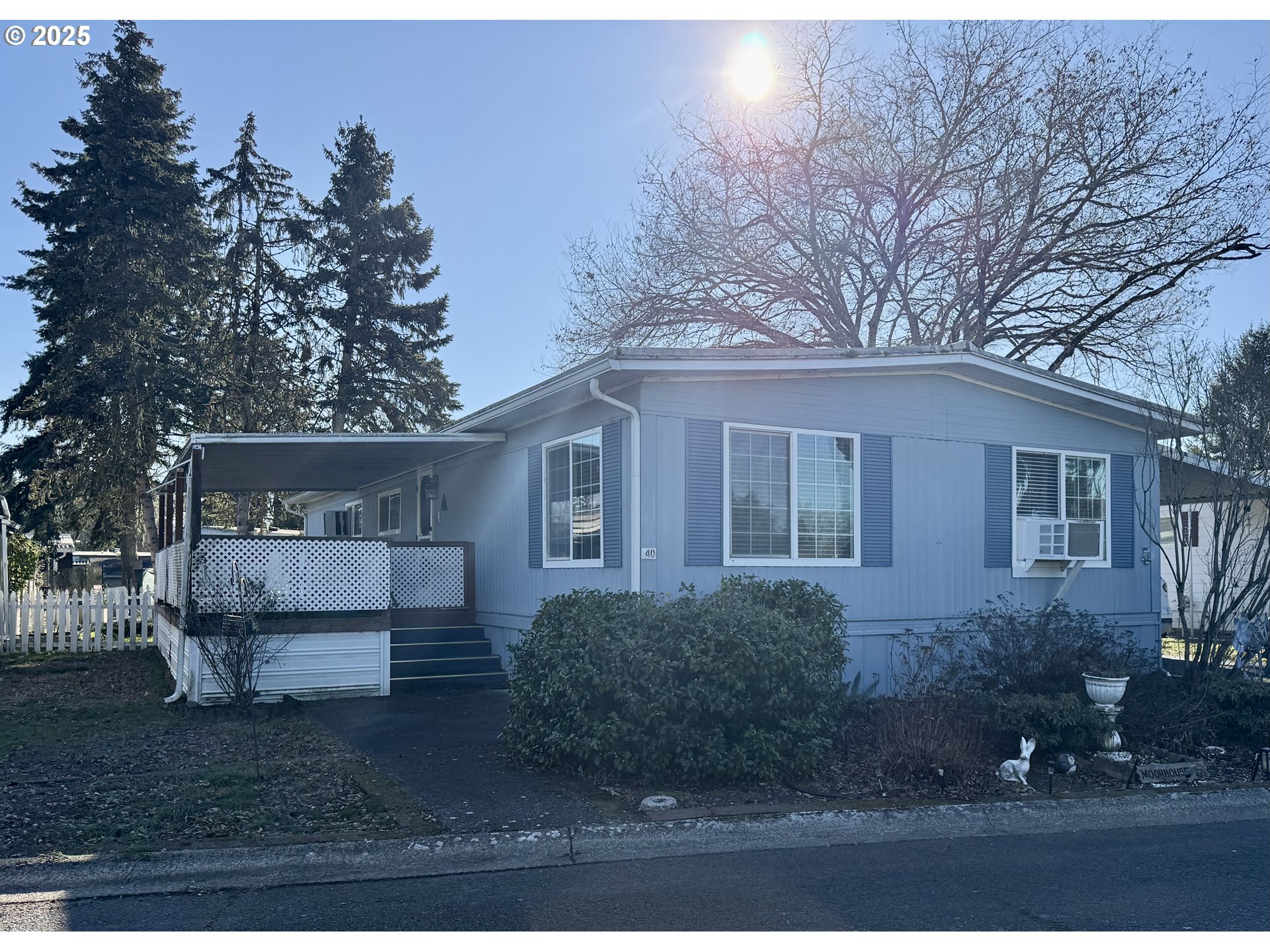 1475 Green Acres Road, Unit 40 Eugene, OR 97408 - Photo 3 of 30 a front view of a house with a yard
