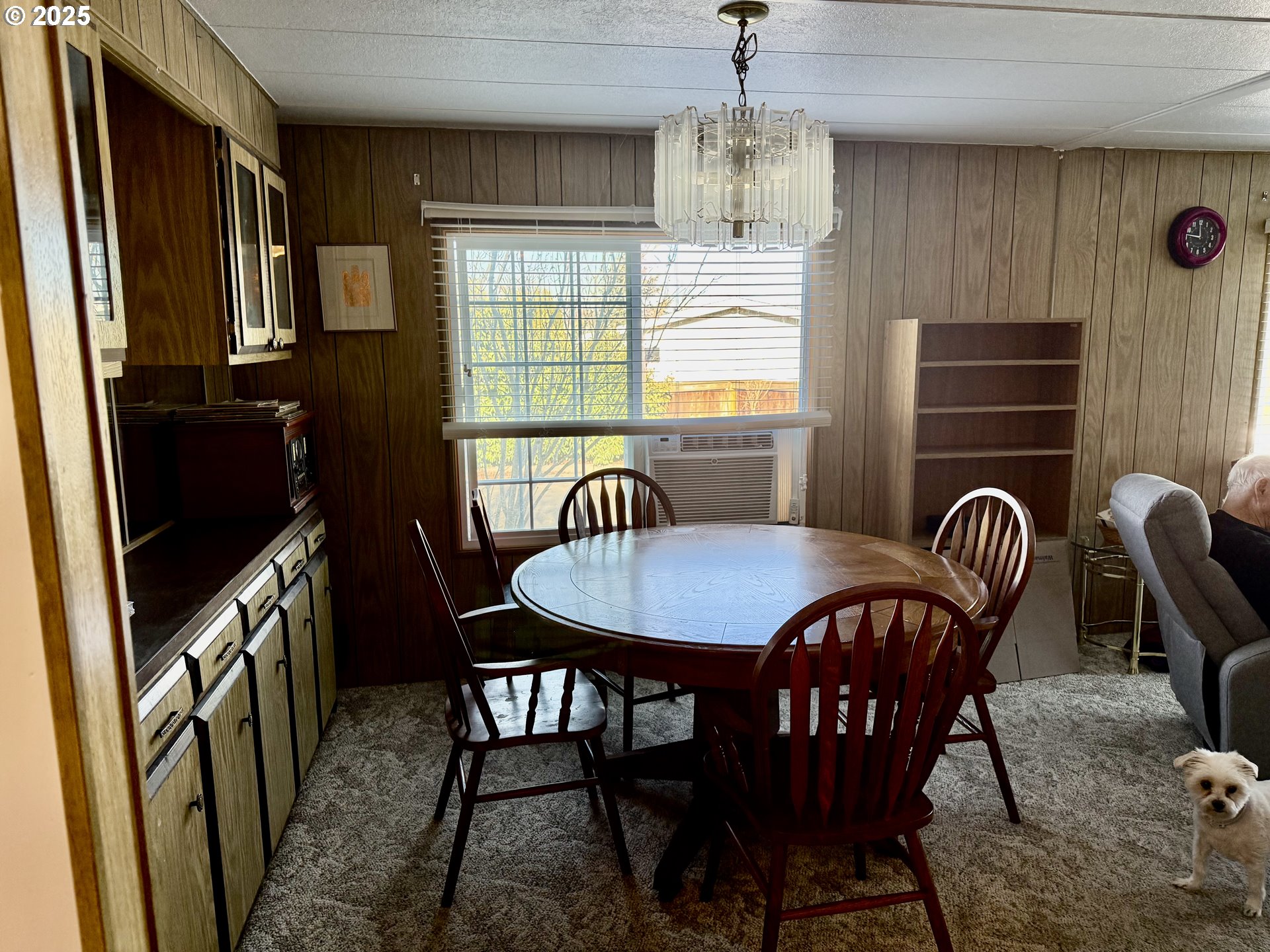 1475 Green Acres Road, Unit 40 Eugene, OR 97408 - Photo 8 of 30 a view of a dining room with furniture window and wooden floor