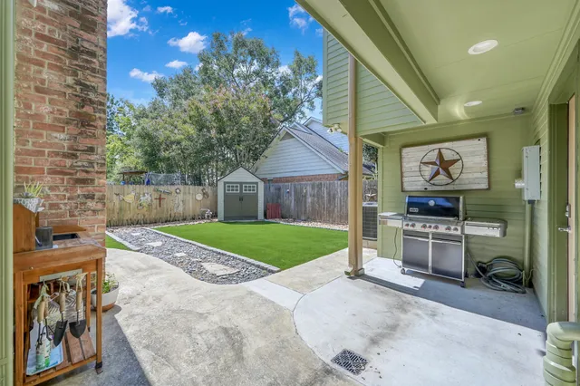 a en suite bathroom with a shower sink and mirror