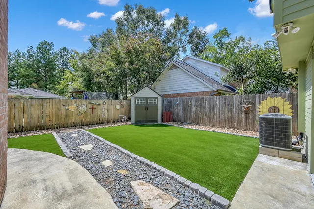 a house view with a backyard space