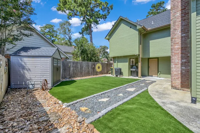a backyard of a house with lots of green space