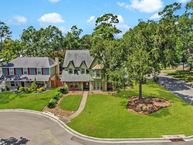 a view of a house with a backyard