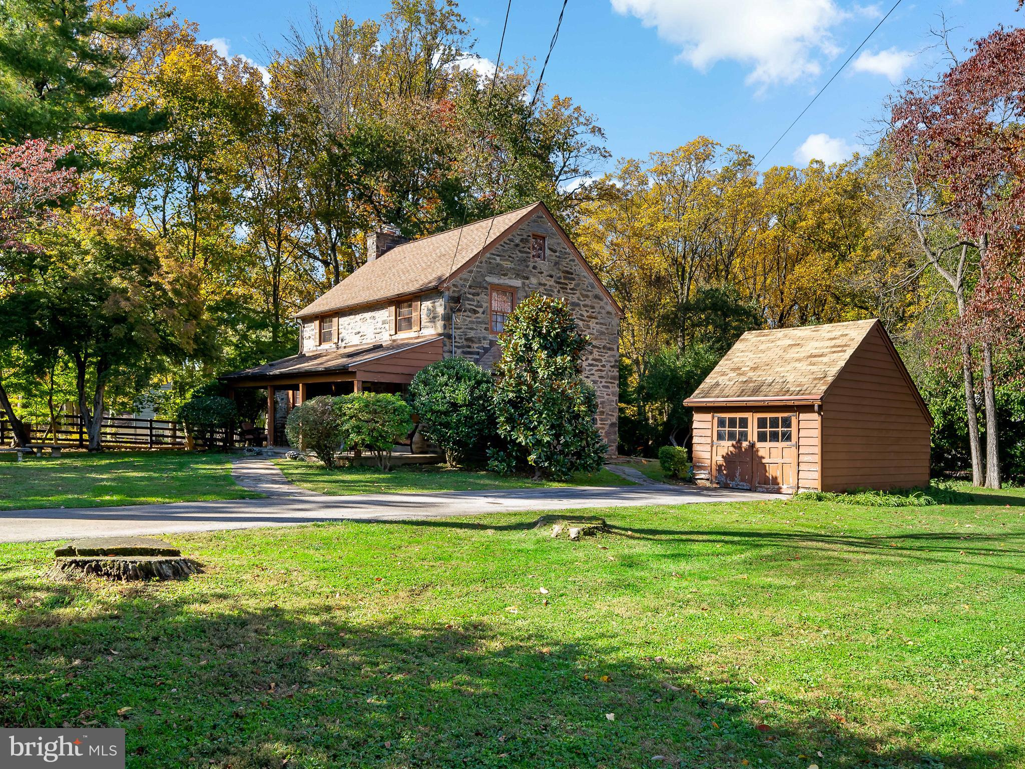 428 Righters Mill Road Gladwyne, PA 19035 - Photo 2 of 9 a front view of house with yard and green space