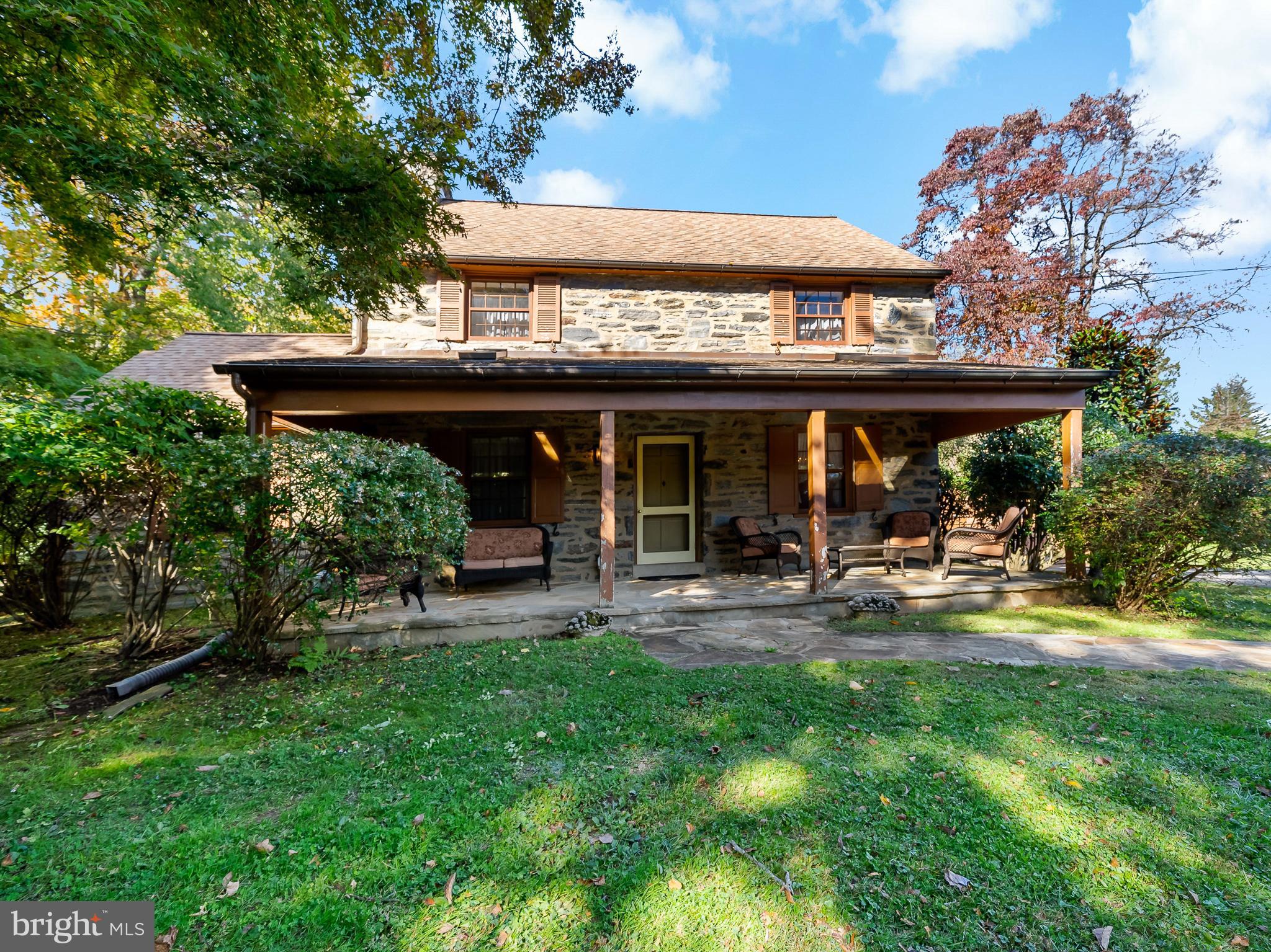 428 Righters Mill Road Gladwyne, PA 19035 - Photo 6 of 9 a view of a house with a yard and sitting area