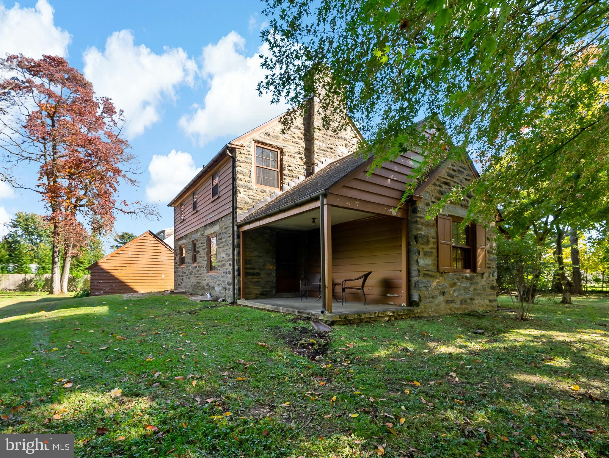 428 Righters Mill Road Gladwyne, PA 19035 - Photo 8 of 9 a front view of house with a garden
