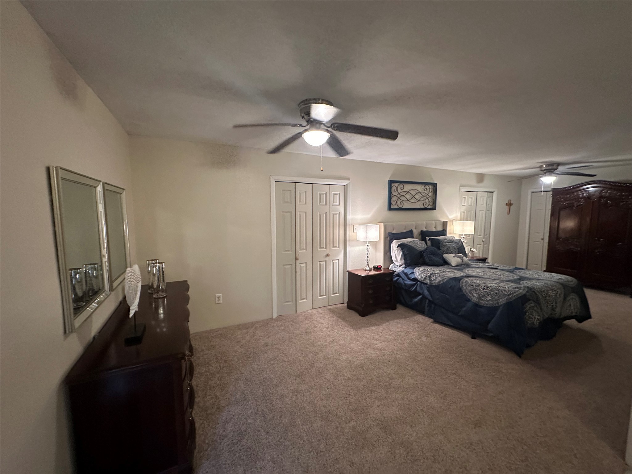 510 Ray Street Buffalo, TX 75831 - Photo 22 of 43 a bedroom with a bed and a chandelier